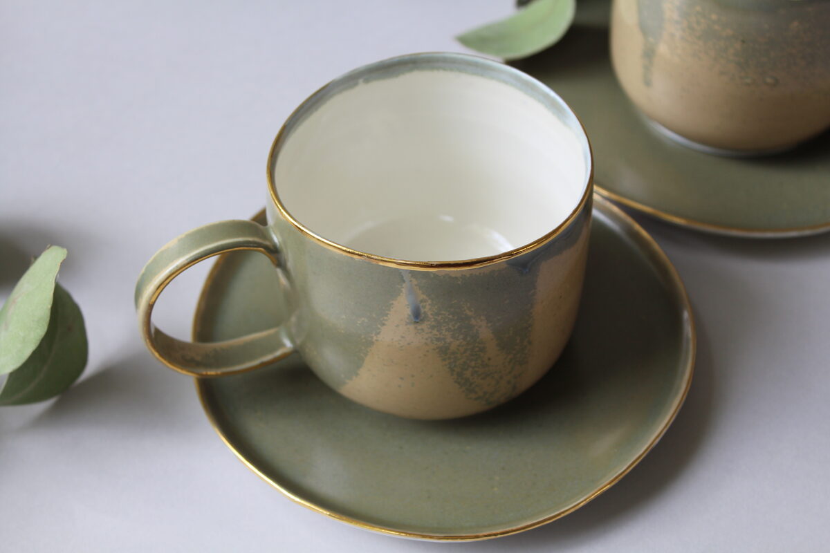 Green porcelain mug with saucer