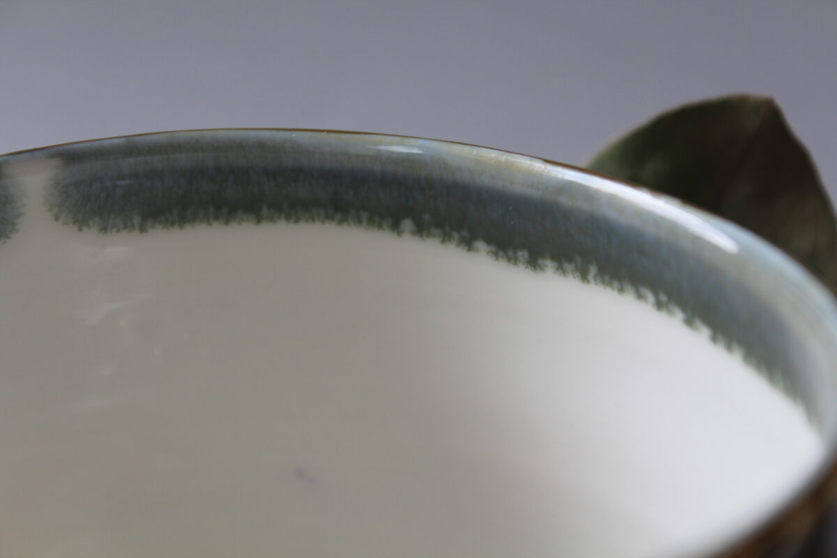 Green porcelain mug with saucer